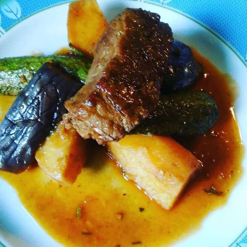 Veal with summer vegetables in  sauce